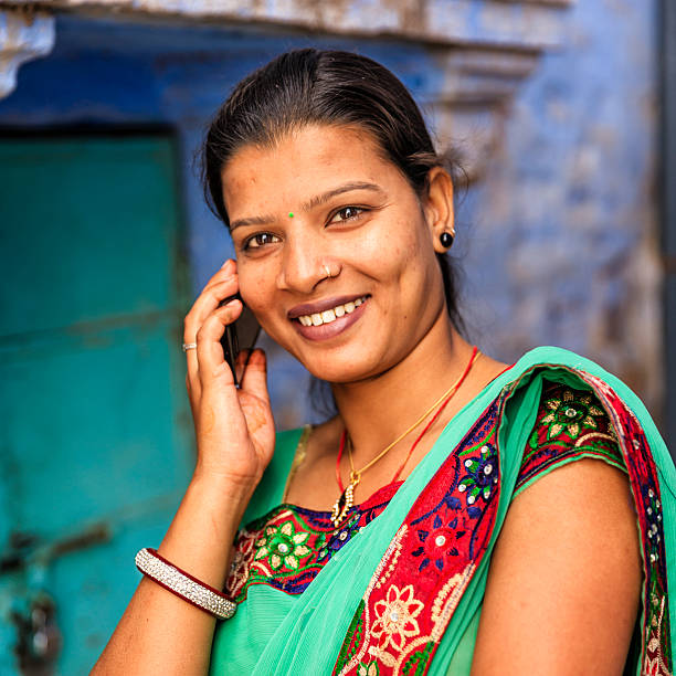 istock Young Indian woman using mobile phone, Jodhpur, India 547448358
