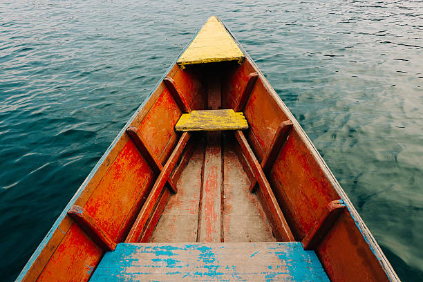 Colorful small boat detail on Phewa Lake in Pokhara, Nepal