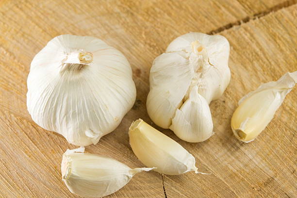 istock Whole and slices of garlic. Healthy vegetable 547449556