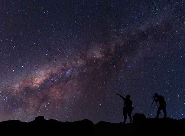 istock Person is standing next to the Milky Way galaxy 547451358