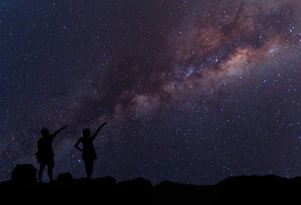 istock Person is standing next to the Milky Way galaxy 547451368