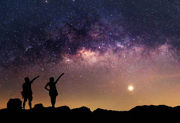 istock Person is standing next to the Milky Way galaxy 547451408