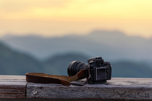 Travel photographer equipment with beautiful landscape on the background, Traveling and Relax Concept.