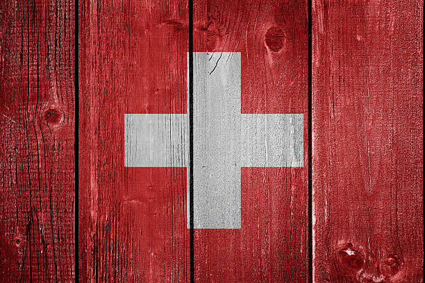 istock Swiss flag on wood background 547493940