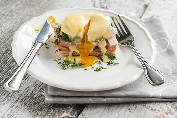 istock eggs Benedict in the context of a hollandaise sauce 547494452