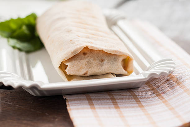 Meat and vegetables in a pita.