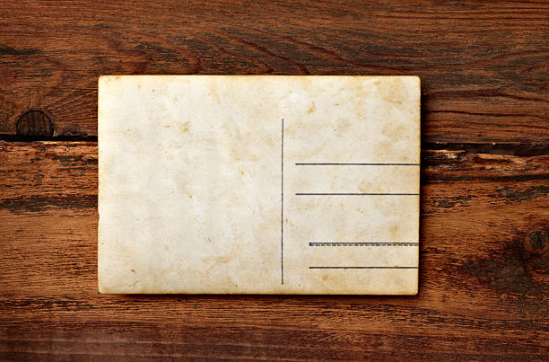 istock old photo postcard and clothes peg on wood 547497712