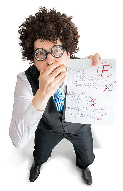 istock Young student is showing math exam with bad grade F. 547497728