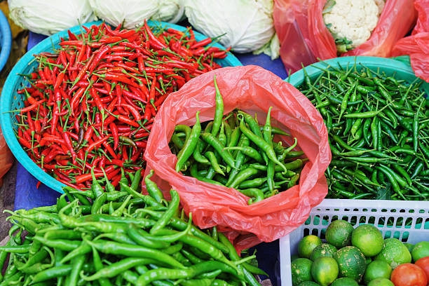 asian street market selling pod pepper and lime in vietnam - lime market vietnam fruit imagens e fotografias de stock