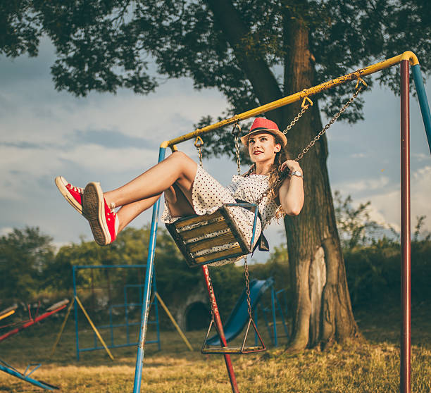 istock Joyful girl swinging 547500924