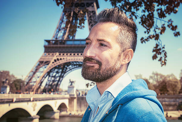 istock handsome bearded tourist in front of Eiffel tower 547502866