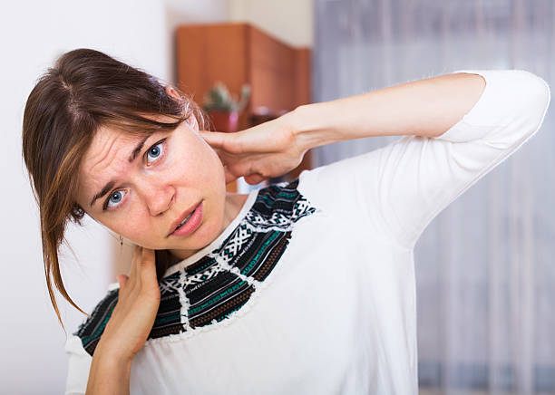 istock Woman feeling pain in neck 547503032