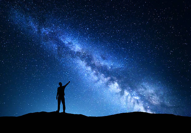istock Milky Way. Silhouette of a standing man 547505150