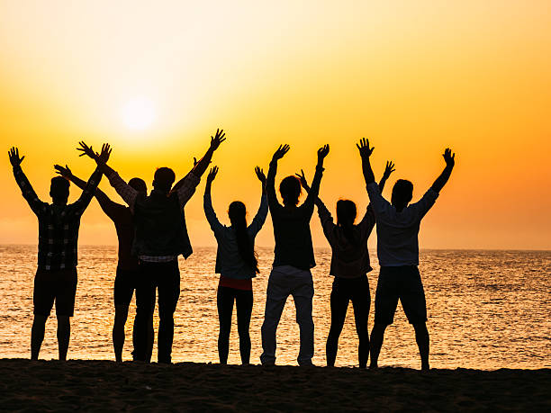istock Young people exercising on the beach 547505298