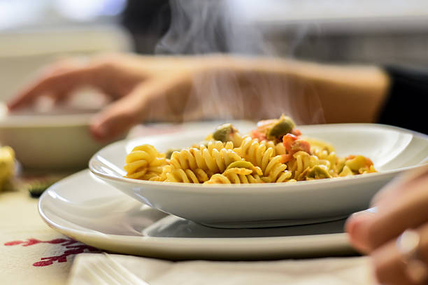 fusilli pasta with tuna fish and olives sauce 