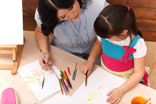 istock Mother and daughter drawing 547509114