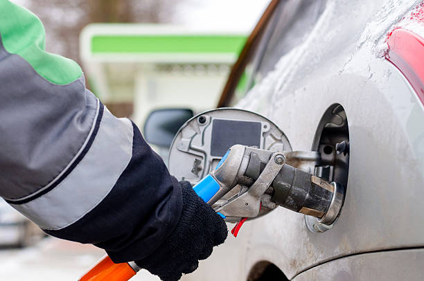 istock Fuel nozzle to refill fuel in car 547509866