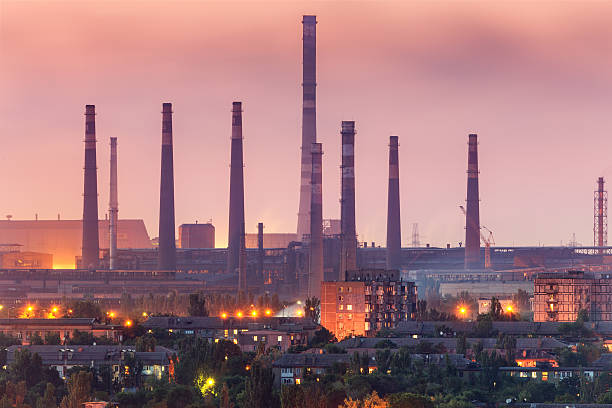 istock Steel factory with smokestacks at night. 547509986