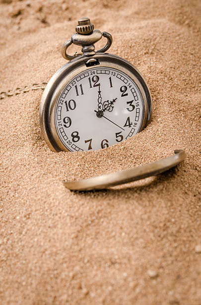 istock Vintage necklace watch on the sand beach 547510262