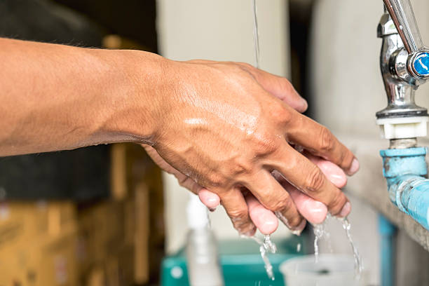 istock Washing hands under flowing tap water 547512776