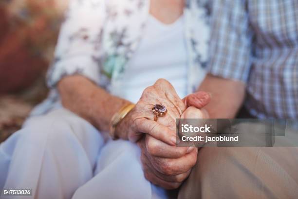 Elderly Couple Holding Hands Stock Photo - Download Image Now - Senior Adult, Holding Hands, Senior Couple