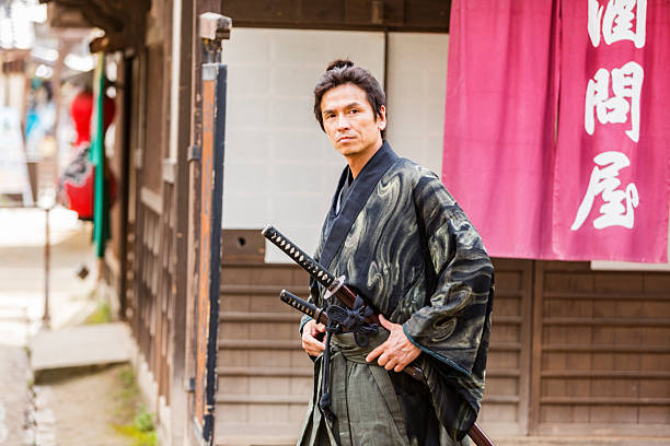 Ronin samurai warrior with his katana sword in a traditional Edo Era Japanese village