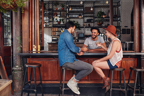 istock Group of friends sitting and talking at a cafe 547514134
