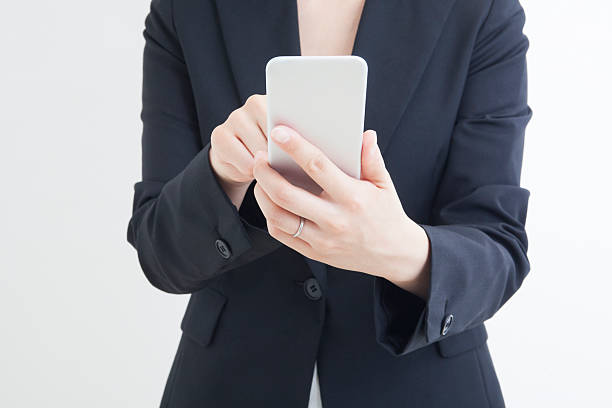 istock Close-up of woman using smart phone 547514404