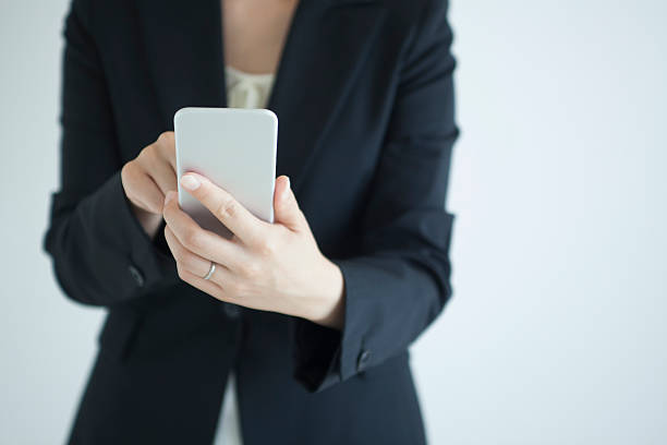 istock Close-up of woman using smart phone 547514650