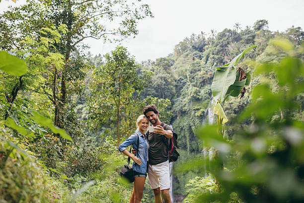 istock Young tourists taking selfie in the forest 547515078