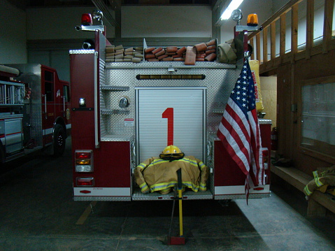 Memorial with an American Flag and fire gear