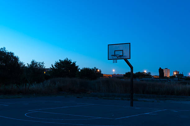 Basketball city playground at sunset