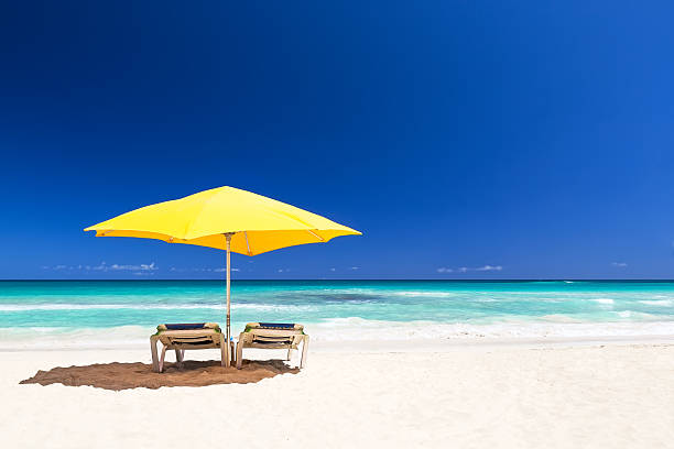 istock Beach chairs with umbrella and beautiful sand beach 547517794