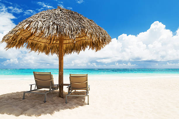istock Beach chairs with umbrella and beautiful sand beach 547517860