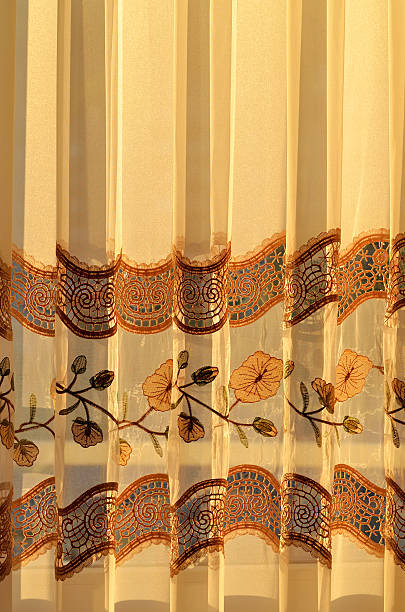 istock Luxury draped golden decorative curtain indoors at sunset 547519158