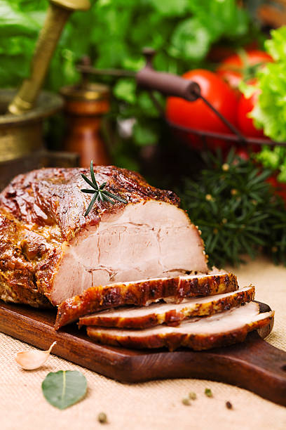 istock Roast pork with herbs and vegetables. 547520624