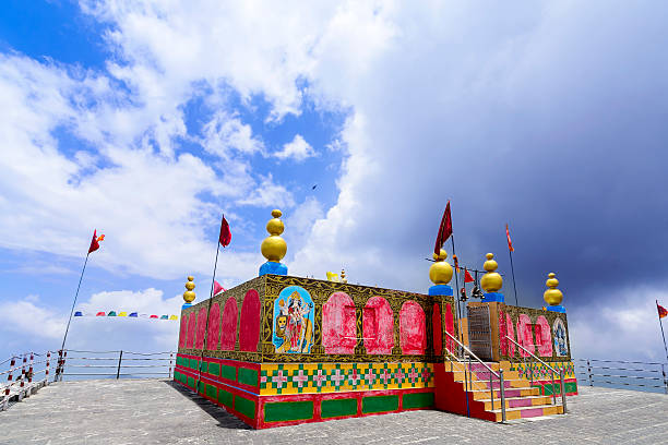 Shikari Mata / Devi Roofless Temple (The Hunter Goddess), Himalaya Glorious colorful roofless shrine of Shikari Mata / Devi Temple (The Hunter Goddess) at a height of 2850 meters above sea level near Janjehli valley, Himachal Pradesh, India kali statue stock pictures, royalty-free photos & images