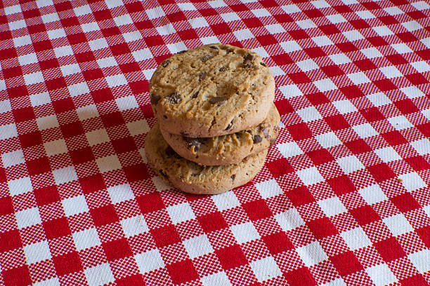 istock Artisanal biscuits with pieces of chocolate on the tablecloth 547521764