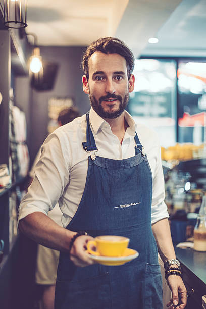 istock Barista is offering a coffee 547522796