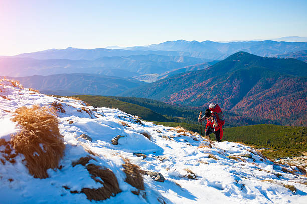 istock The girl with the backpack goes through the snow. 547524874