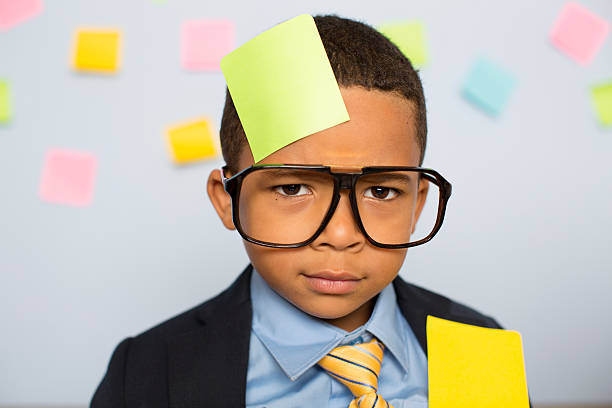 istock Young Businessman at Desk Covered with Blank Sticky Notes 547529440
