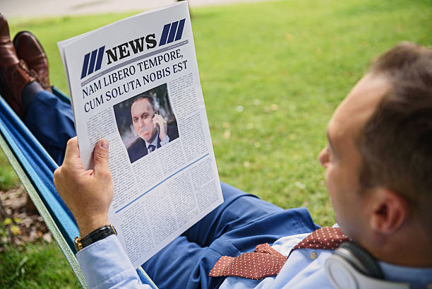 istock Cheerful businessman relaxing in park 547531994