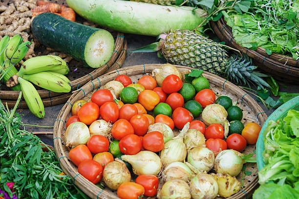 asian street market selling tomato lime onion ananas and banana - lime market vietnam fruit imagens e fotografias de stock