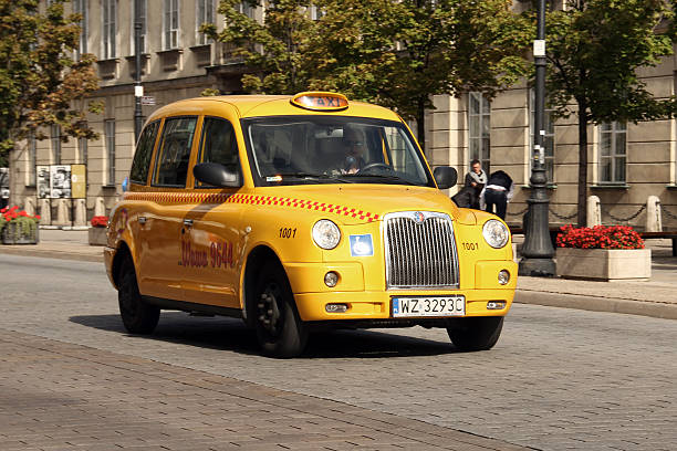Warsaw, Poland - September 24th, 2011: LTI TX4 (London Taxi Company) taxi on the CNG driving on the street. This vehicle is equipped in special wheelchair ramp on the right side of the car. The LTI TX4 is the most popular taxi vehicle in UK.
