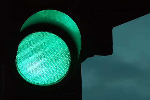istock Green traffic light by night and dark sky at the 547532682