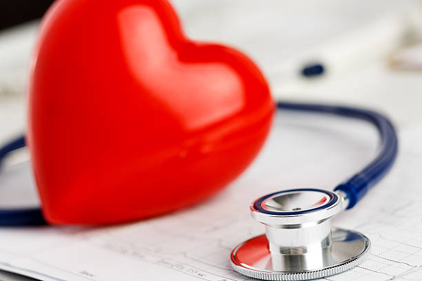 istock Medical stethoscope head and red toy heart 547537404