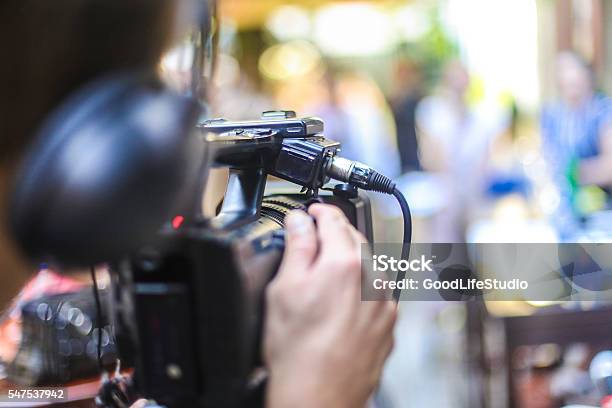 Cameraman Filming Stock Photo - Download Image Now - Outdoors, Camera Operator, Home Video Camera