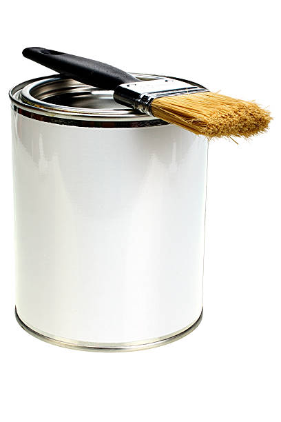 Paint can with blank white label and paintbrush isolated stock photo