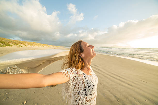 istock Beautiful girl on the beach at sunset 547540394