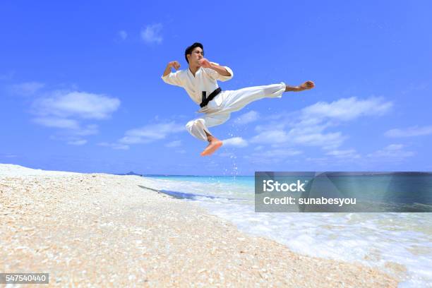 Flying Beach Karate Kick Stock Photo - Download Image Now - Karate, Okinawa Prefecture, Beach